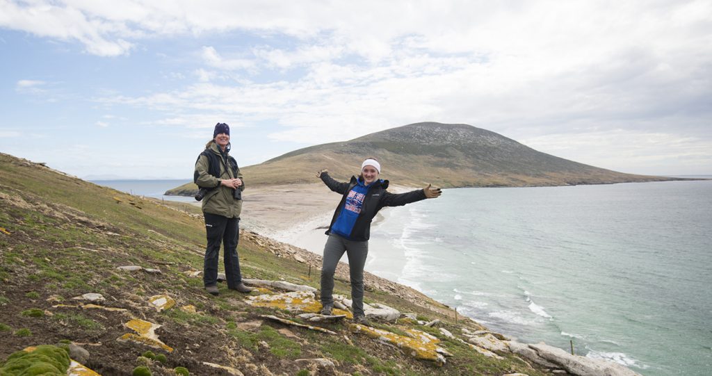Students standing on coastline of Falkland Islands