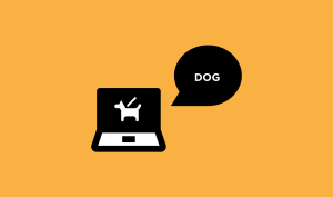 Computer shows an image of a dog. With a text bubble that says "dog".