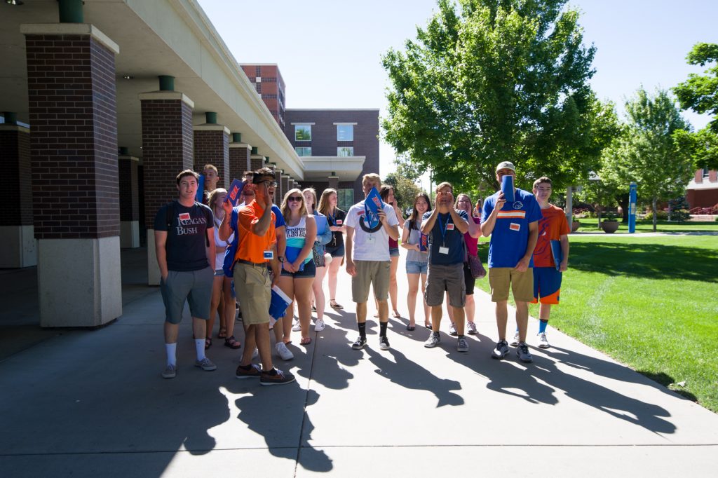 orientation leaders leading a group of students around campus