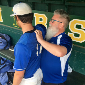 Tony Fitzpatrick stretches a student's shoulder