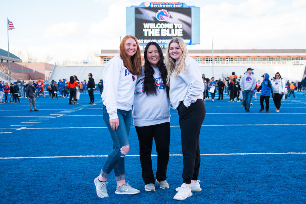 Students take a photo on The Blue at Bronco Day