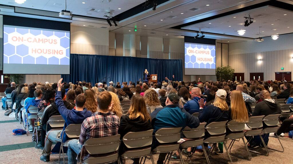 Guests attending a talk in a Boise State Ballroom.
