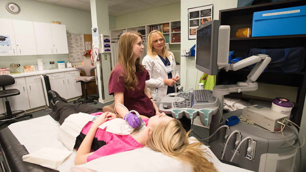 Student using a medical imaging device.