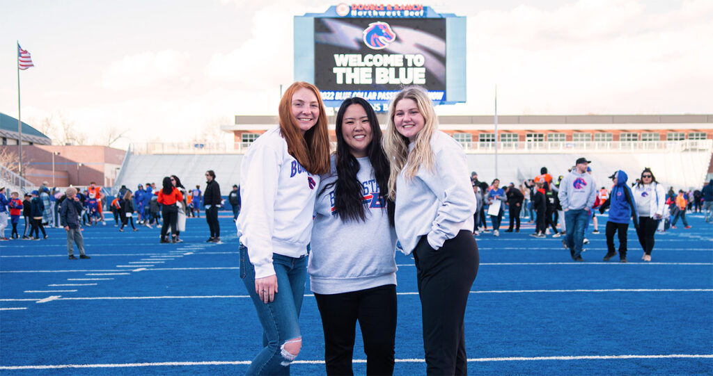 Students pose on the Blue Turf at Bronco Day