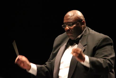 Composer William Owens conducts