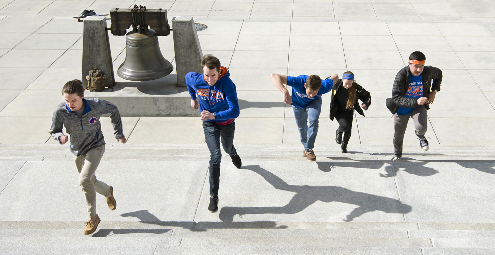 students running up capitol steps