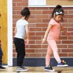 Children walking in a school hallway