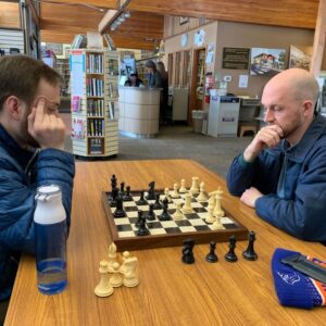 Osterhout and Peterson play chess while waiting to conduct Idaho libraries focus group