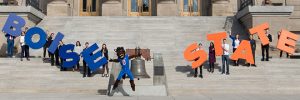 Buster Bronco and Students on capitol steps