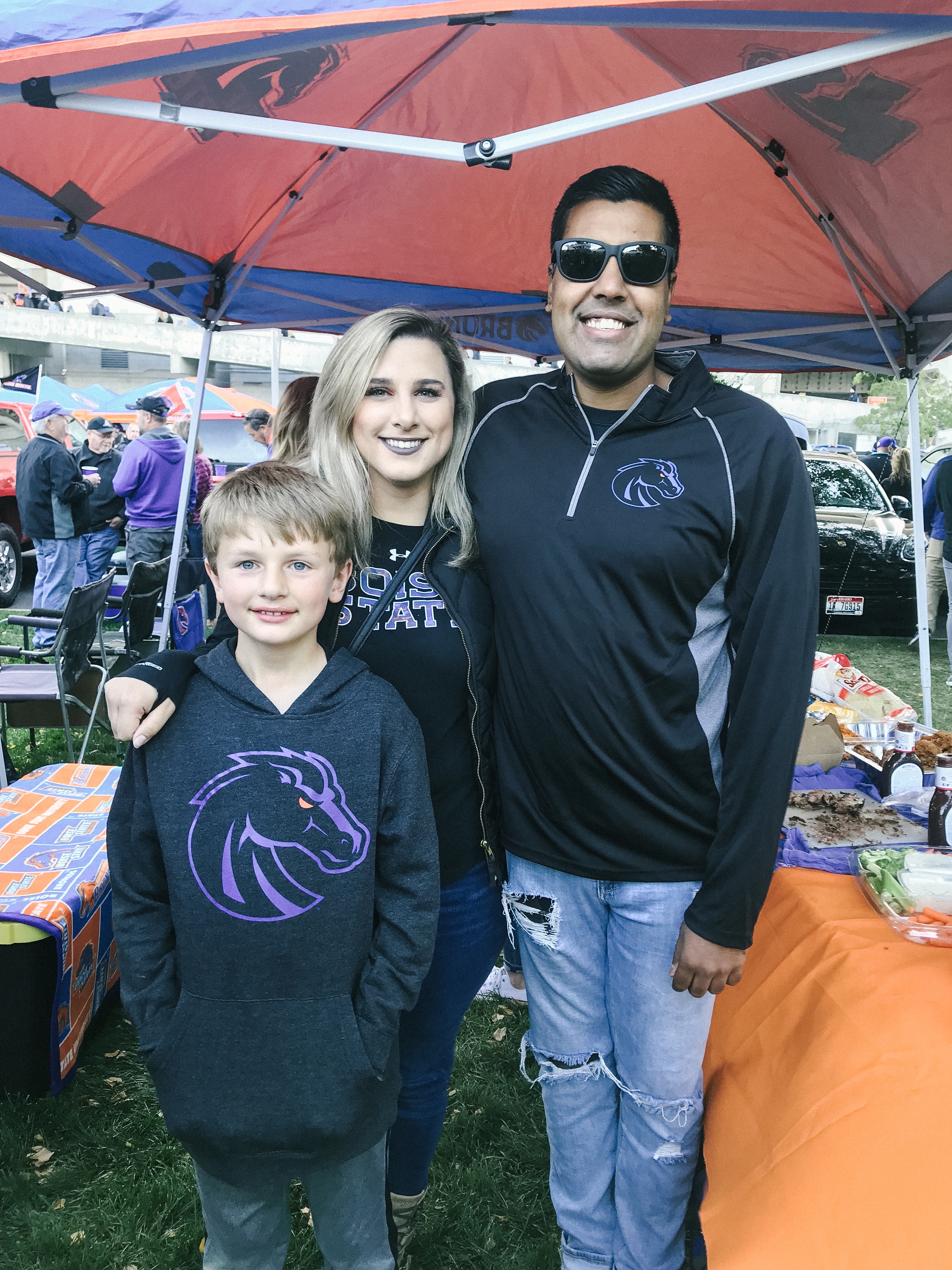 Brodie Taylor, Erin Taylor, and Vijay Singh tailgating during the 2019-2020 Boise State Football season.