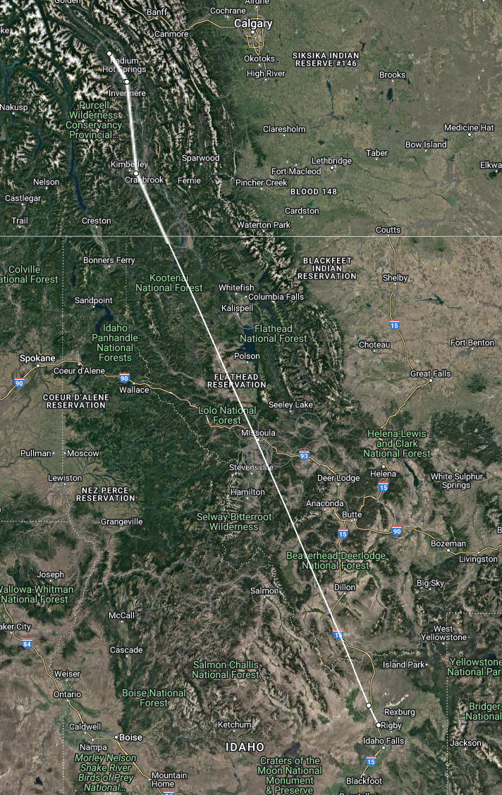 a map of Idaho, southern British Columbia, and Alberta shows a white line connecting dots between snowy mountains in BC, reaching down to a point in southeastern Idaho