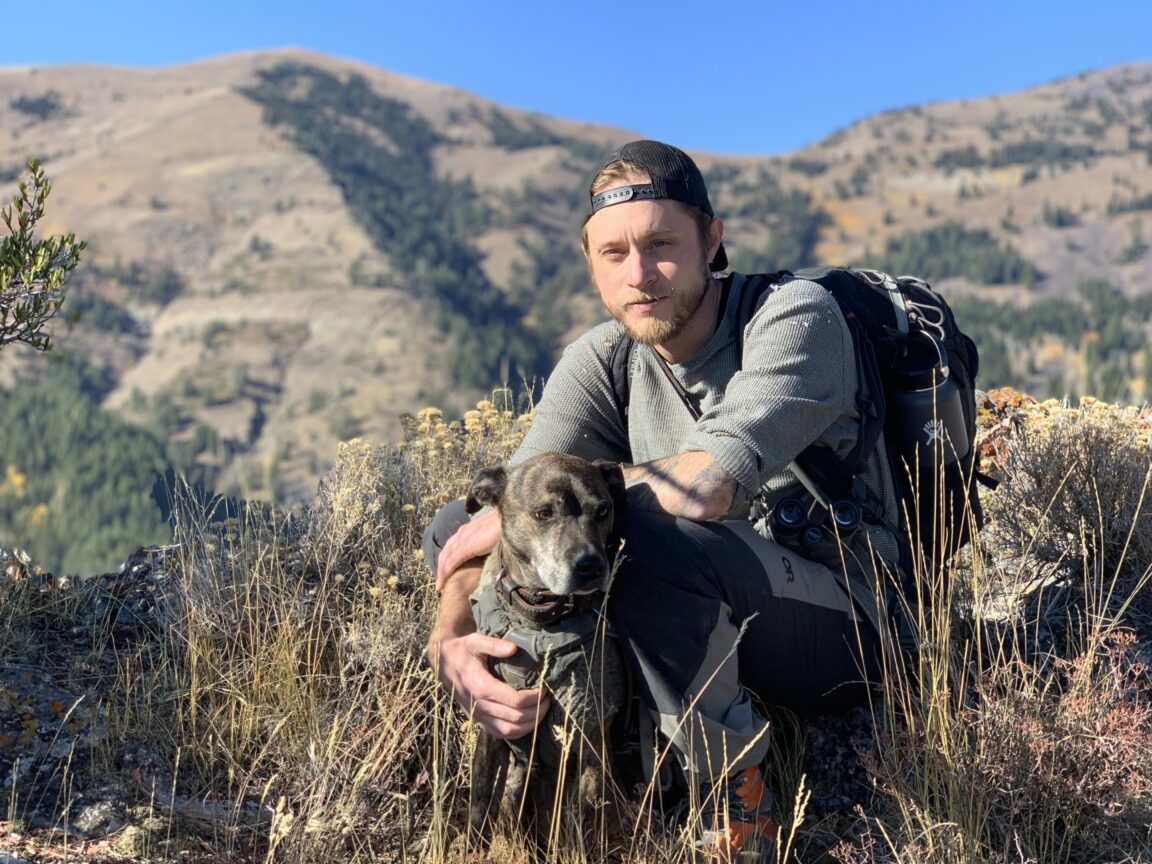 Ryan Healey outdoors with his dog