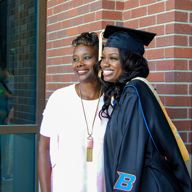 Patrice Elmore and mother pose for a graduation photo
