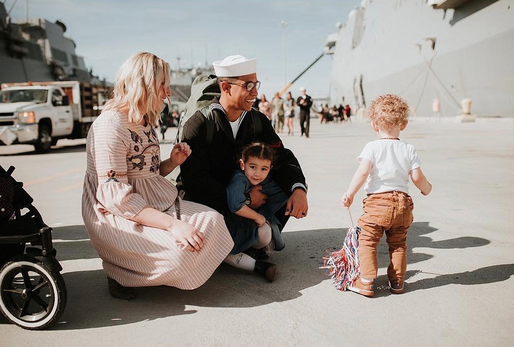 Leonard Rogers and family pictured at navy ship dock.
