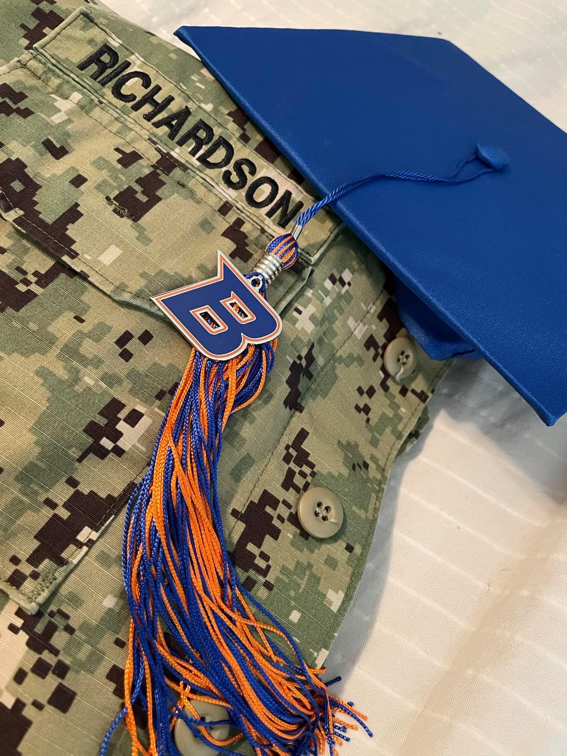 Austin Richardson's Naval uniform is pictured with his Boise State graduation cap. 