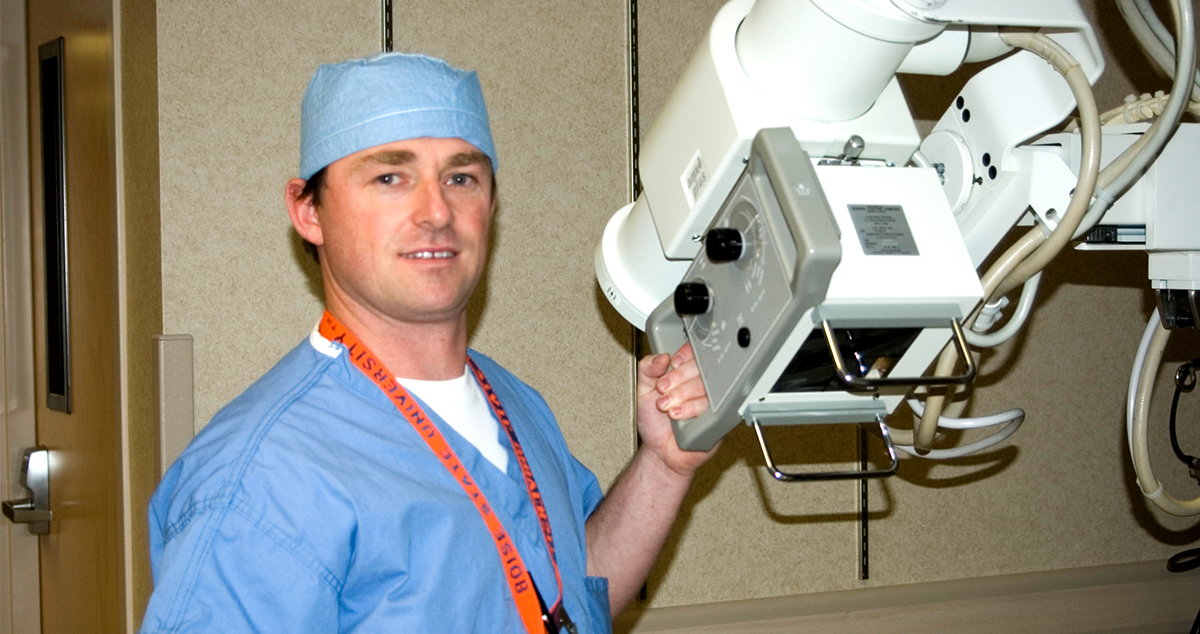 Man standing near health imaging equipment