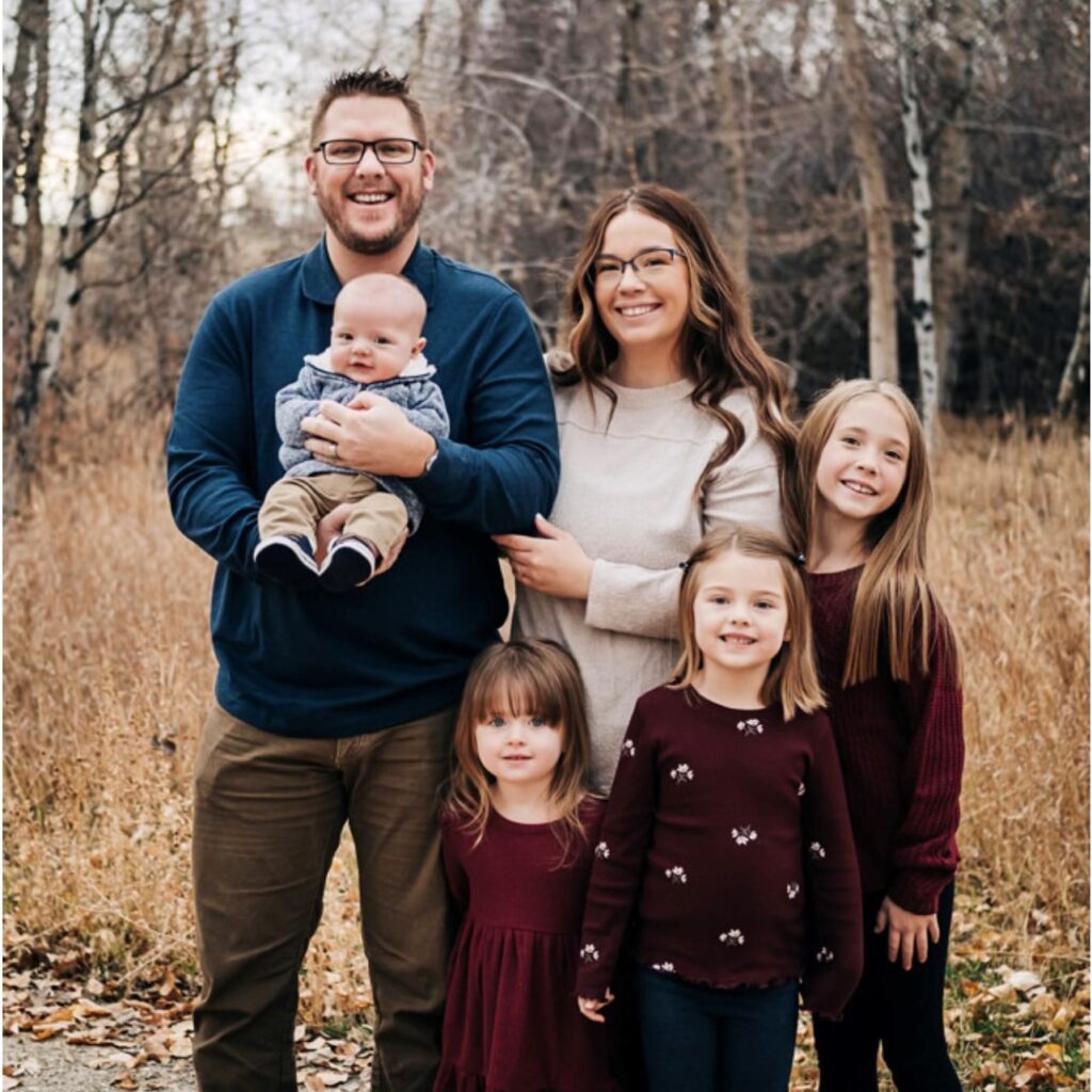 Cody Stokes with his wife and four children