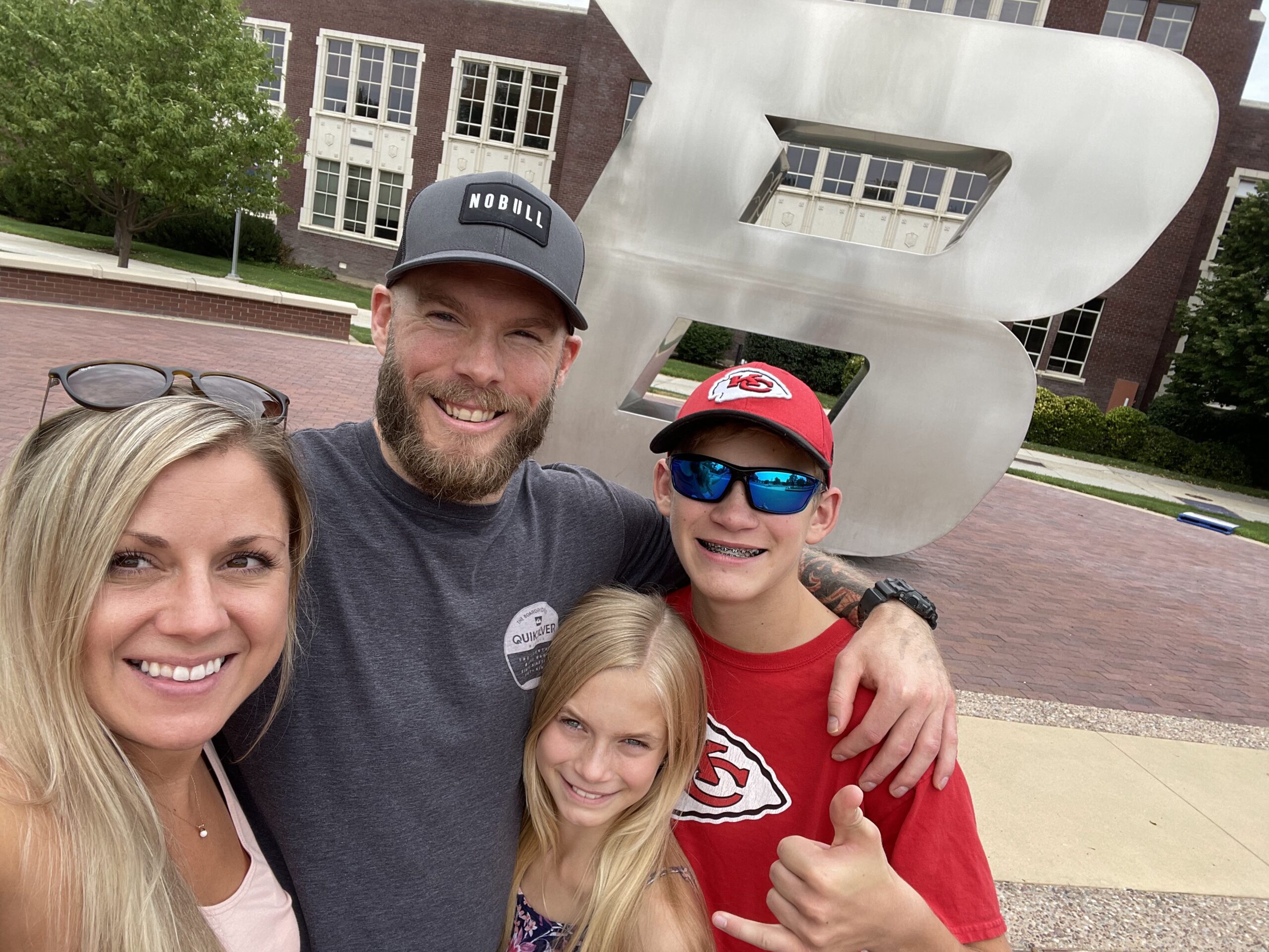 Brent Beckwith with his family in front of the "B" metal sculpture. 