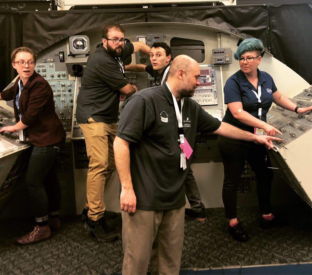 Team goofing off inside spacecraft