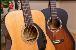 Two six-string guitars of the acoustic steel-string type