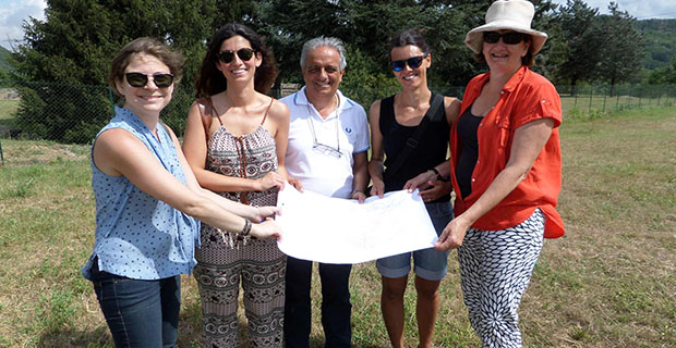 Boise State assistant professor Katie Huntley, Libarna site director Melania Cazzulo, Serravalle Scrivia Mayor Alberto Carbone, archaeologist and interpreter Sabrina Carrea, and University of Leicester professor Penelope Allison with a map of the archaeological site.