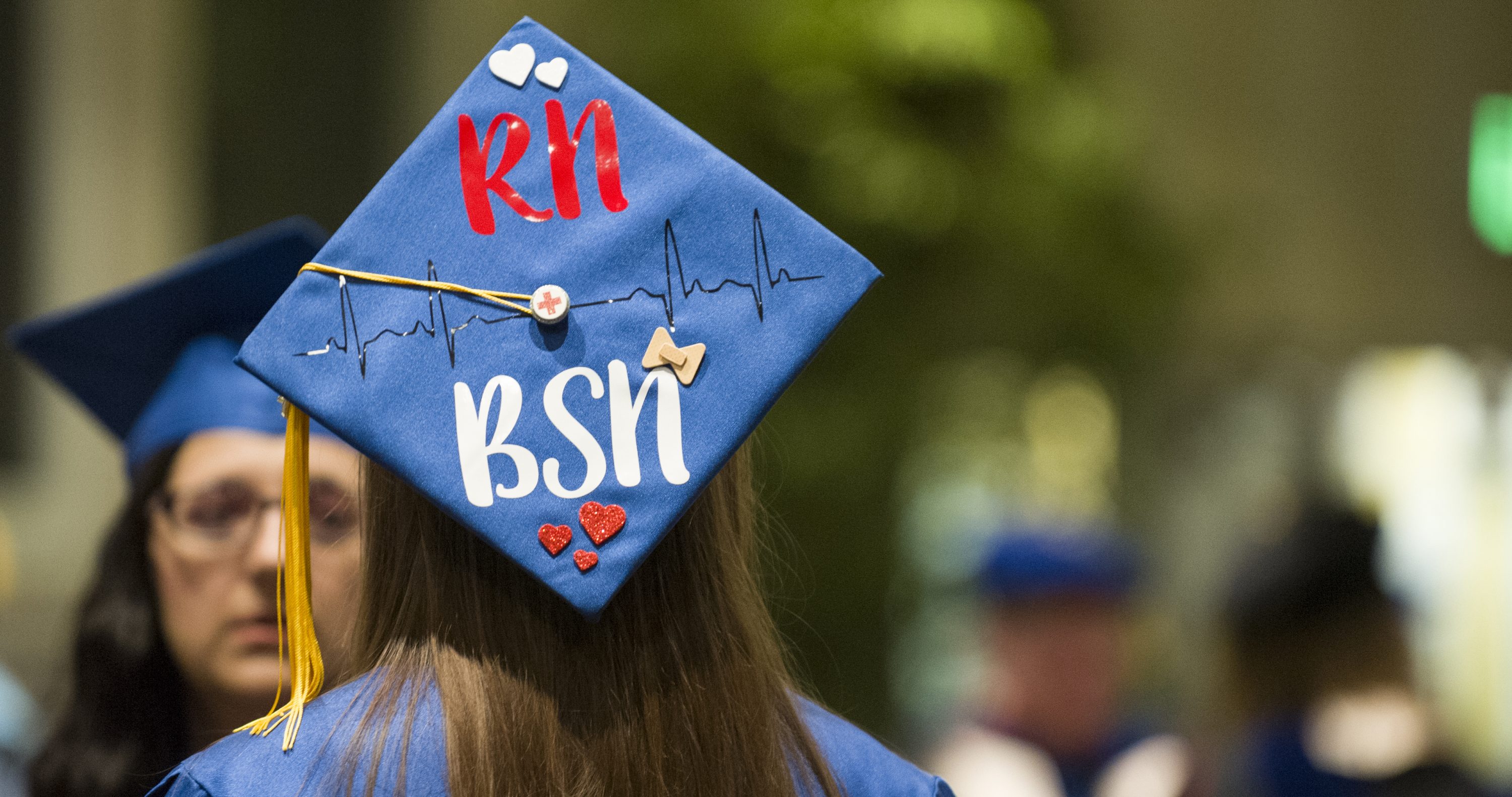 Photo of graduation cap that reads "RN BSN"