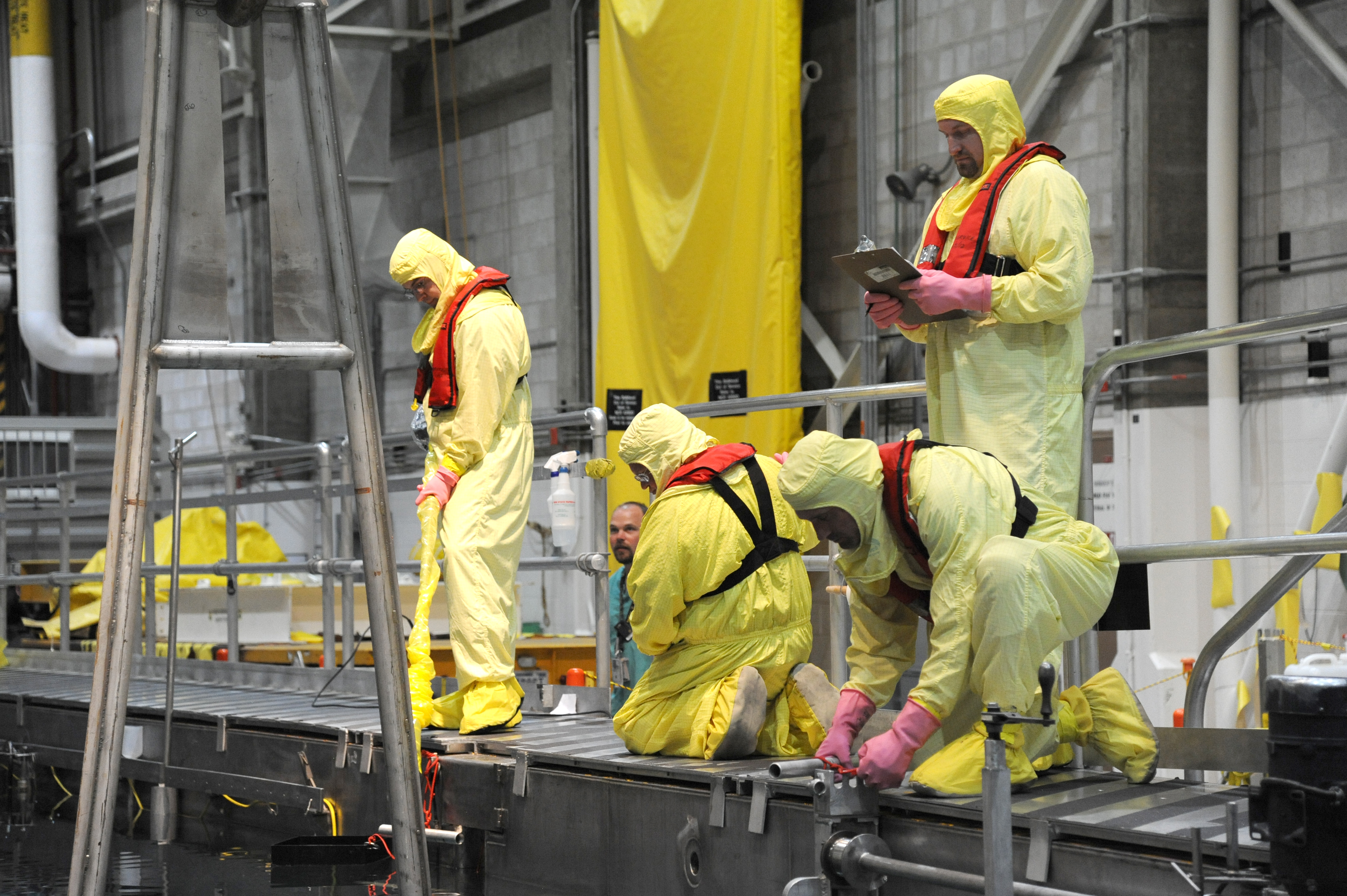 People working on a nuclear reactor
