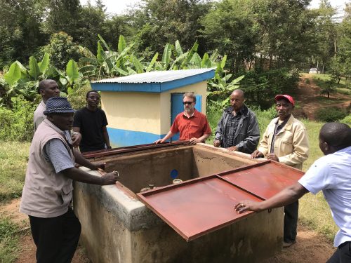 Brian Wampler and others around Kenya water system