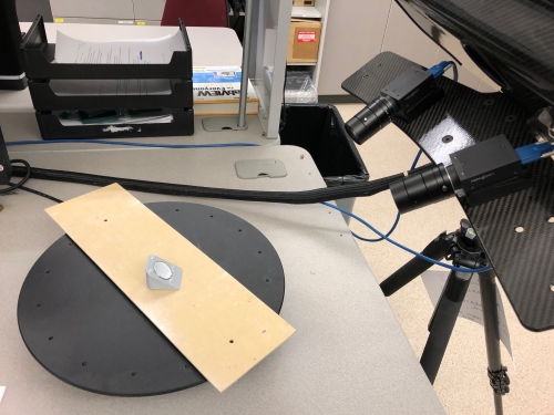 A 3D optical scanner examines plastic used in hip or joint replacement devices.