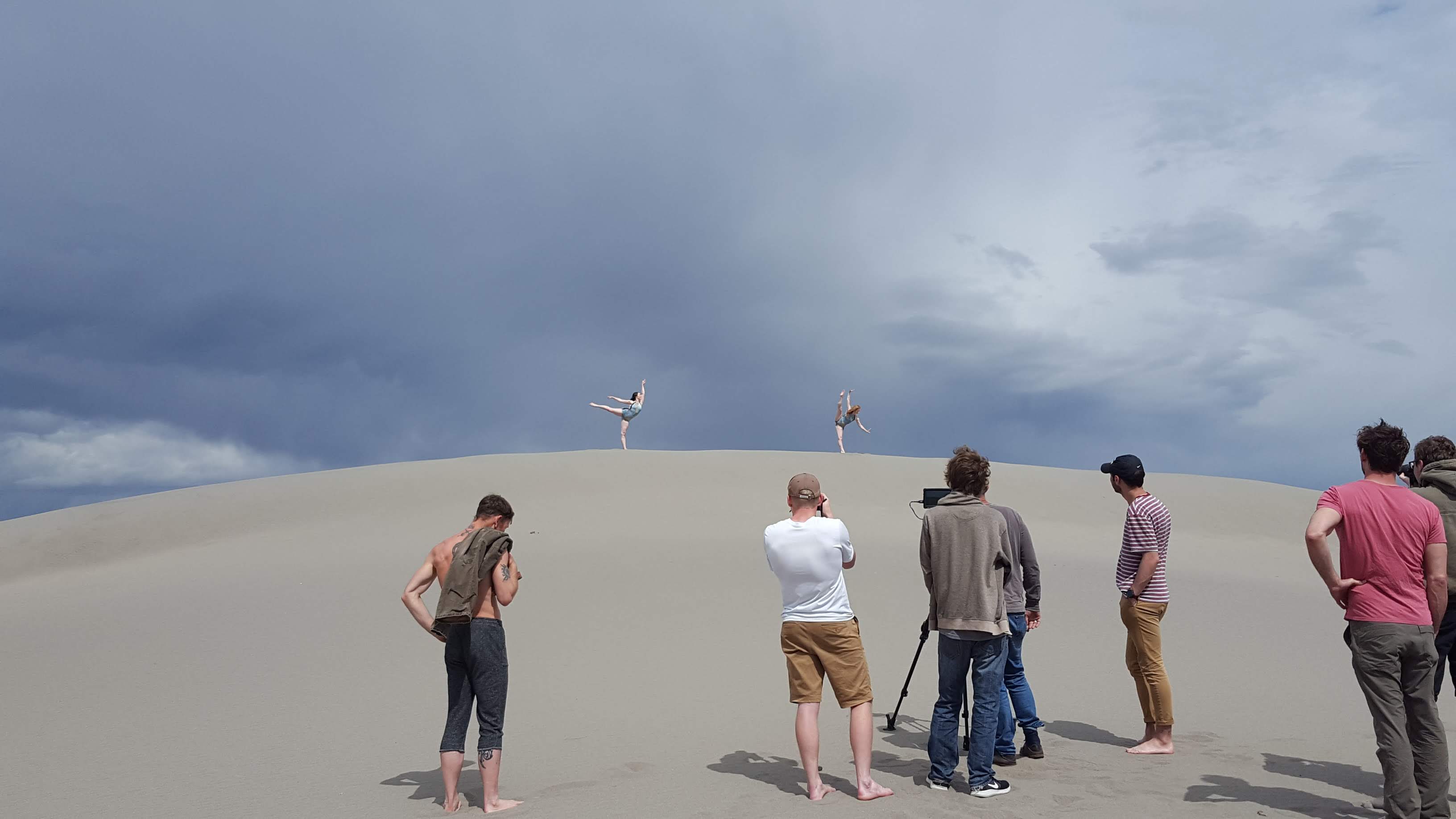 Dancers on sand dunes