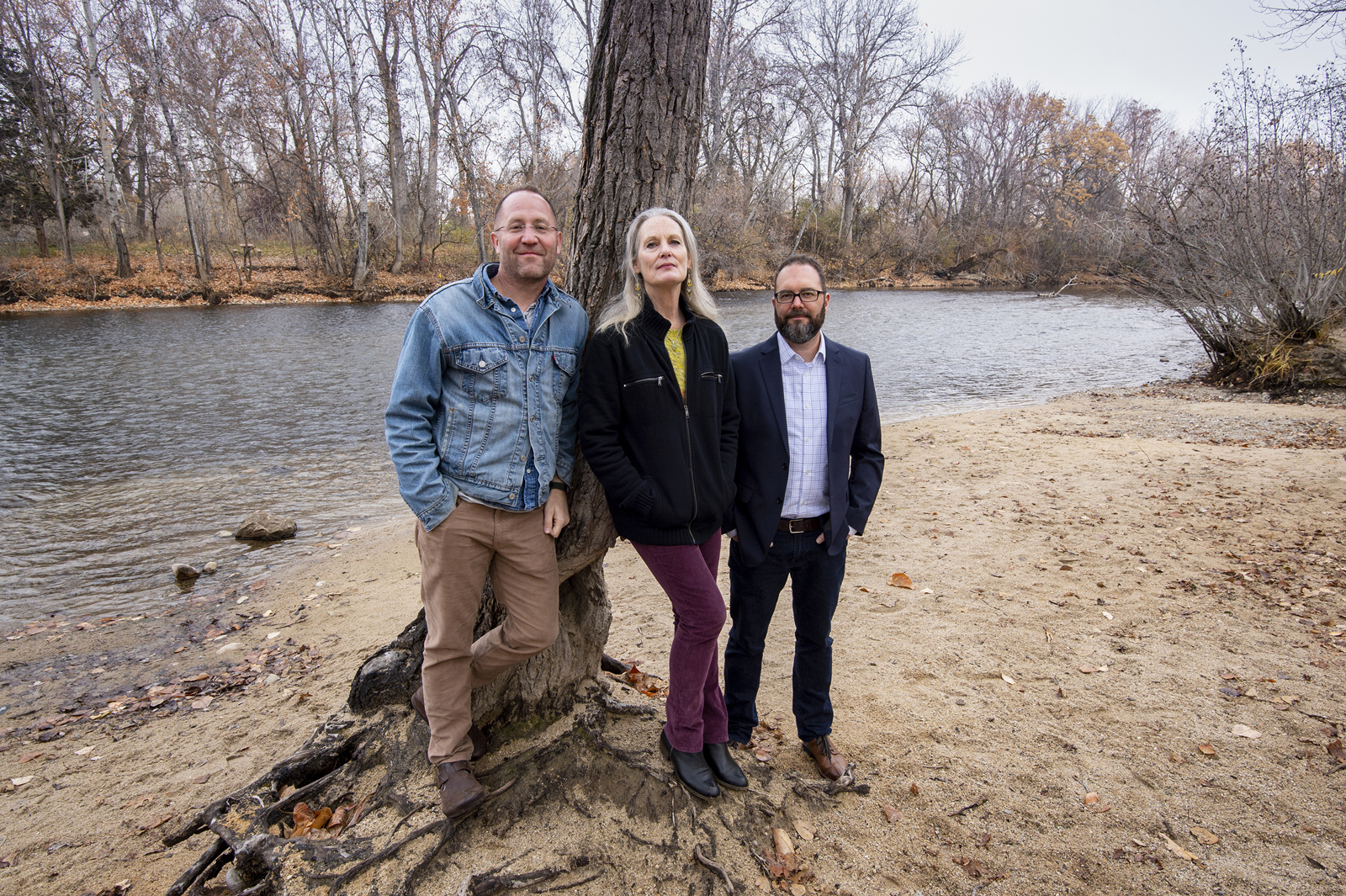 Three faculty standing next to Boise River