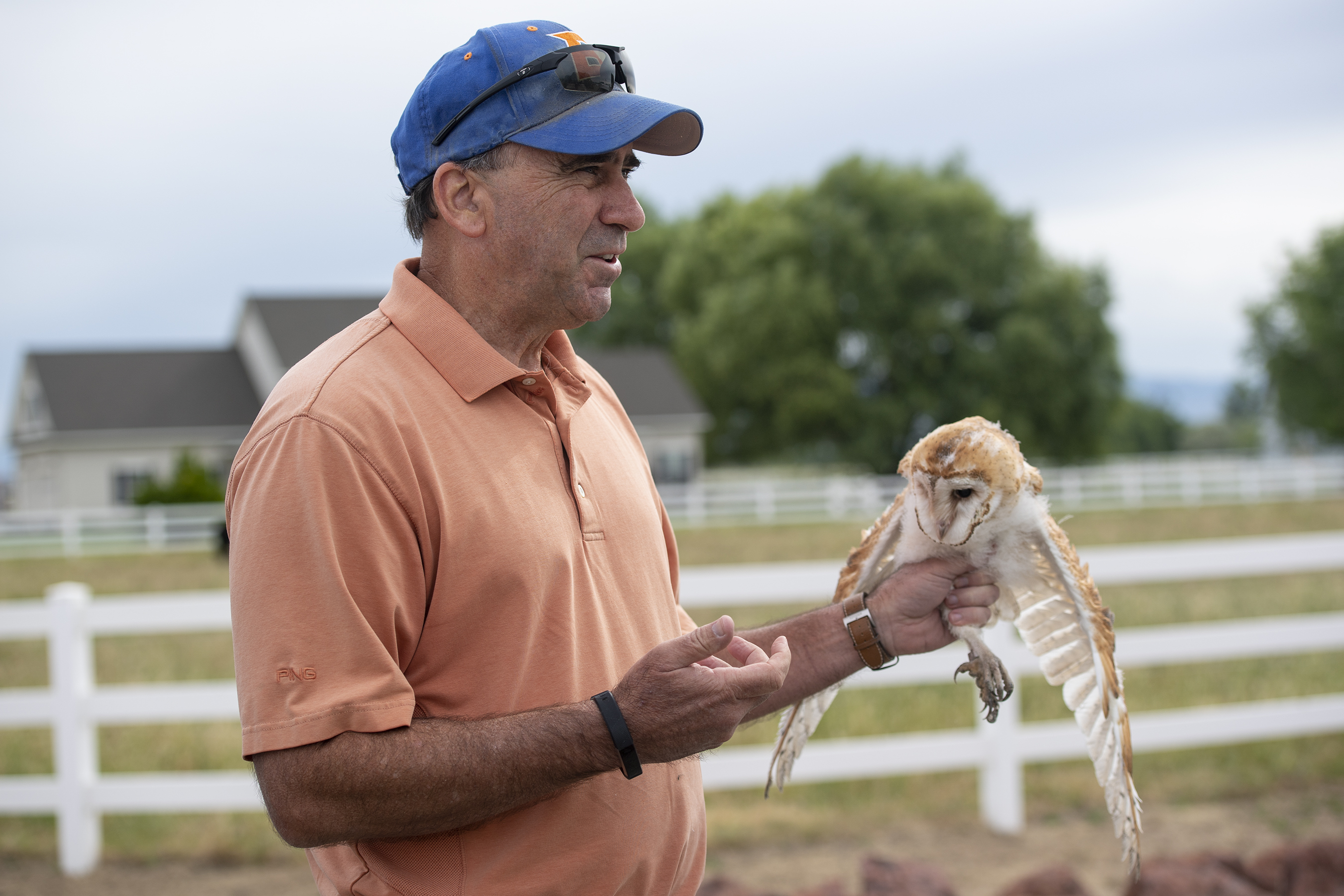 Jim Belthoff holds barn owl