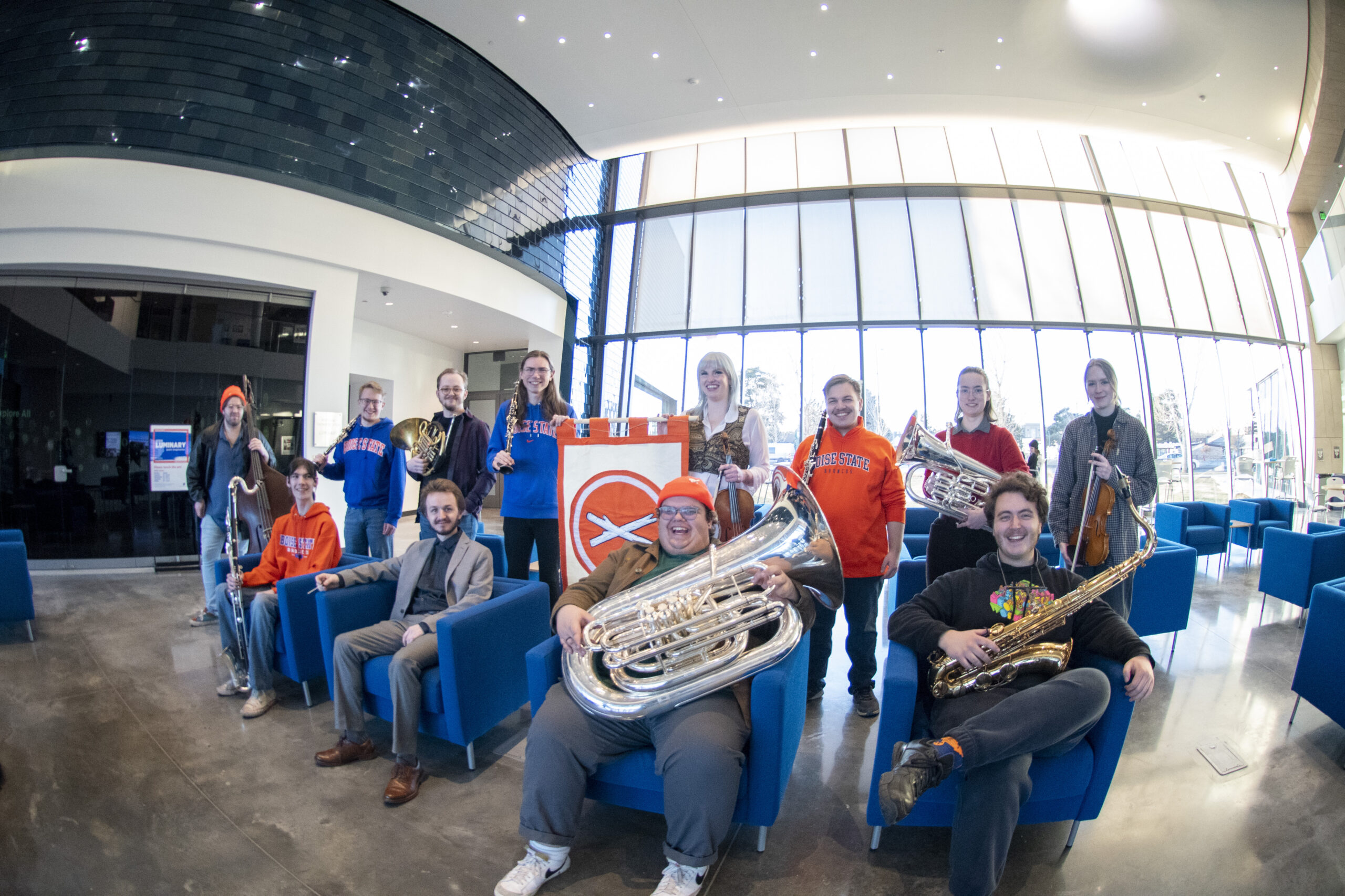 A group of musicians pose in the Center for the Visual Arts