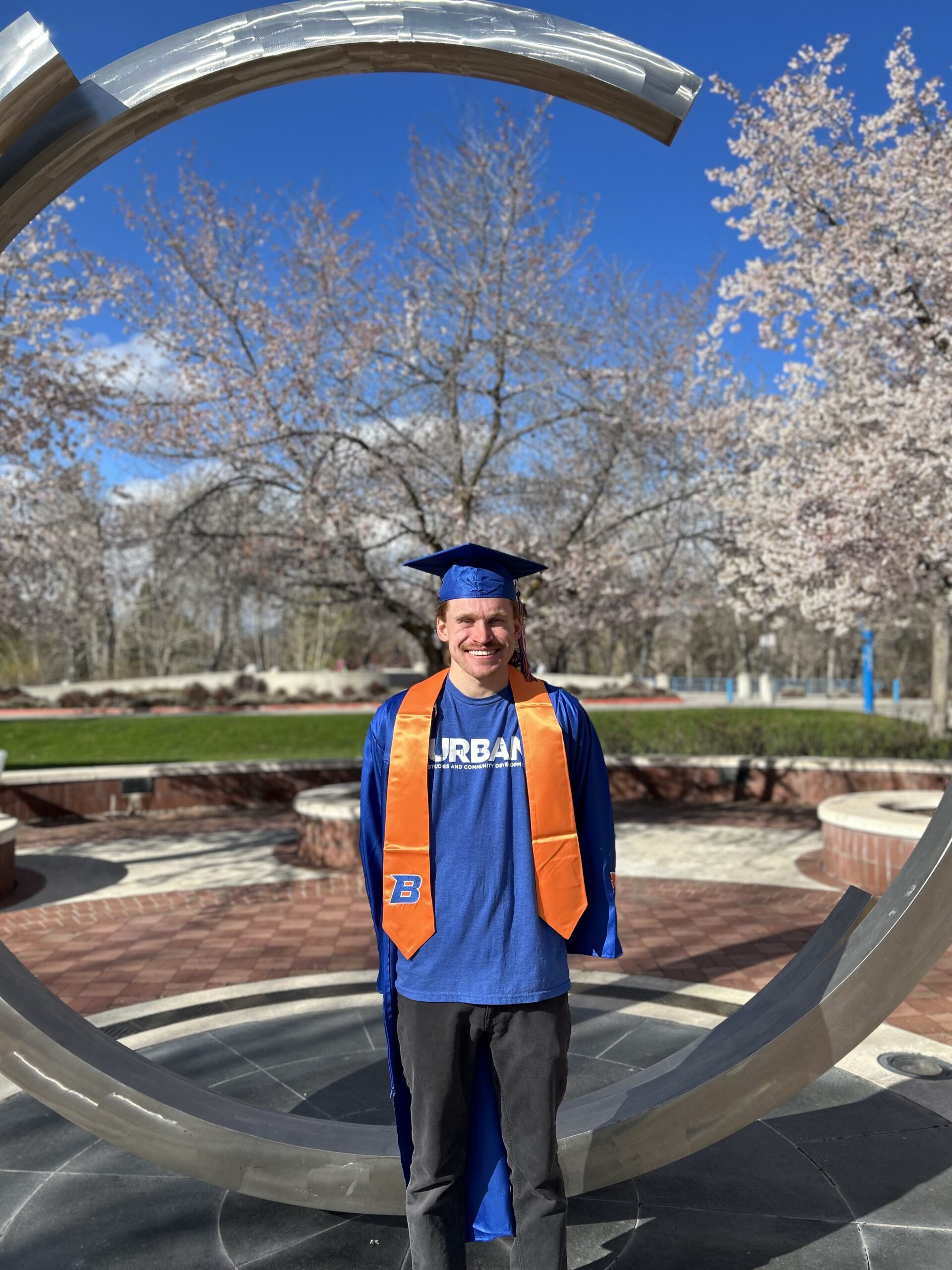Nathaniel Campbell poses on campus in his Boise State regalia