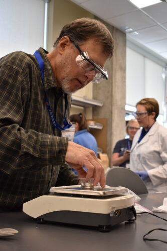 An Idaho teacher conducts an afforable experiment in the Micron School of Materials Science and Engineering at Boise State.