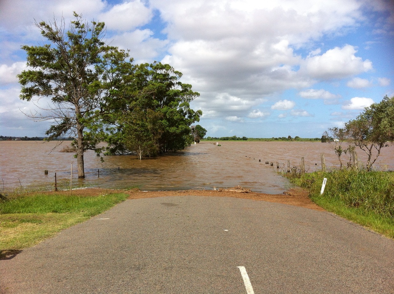 a photograph of a flooded country road