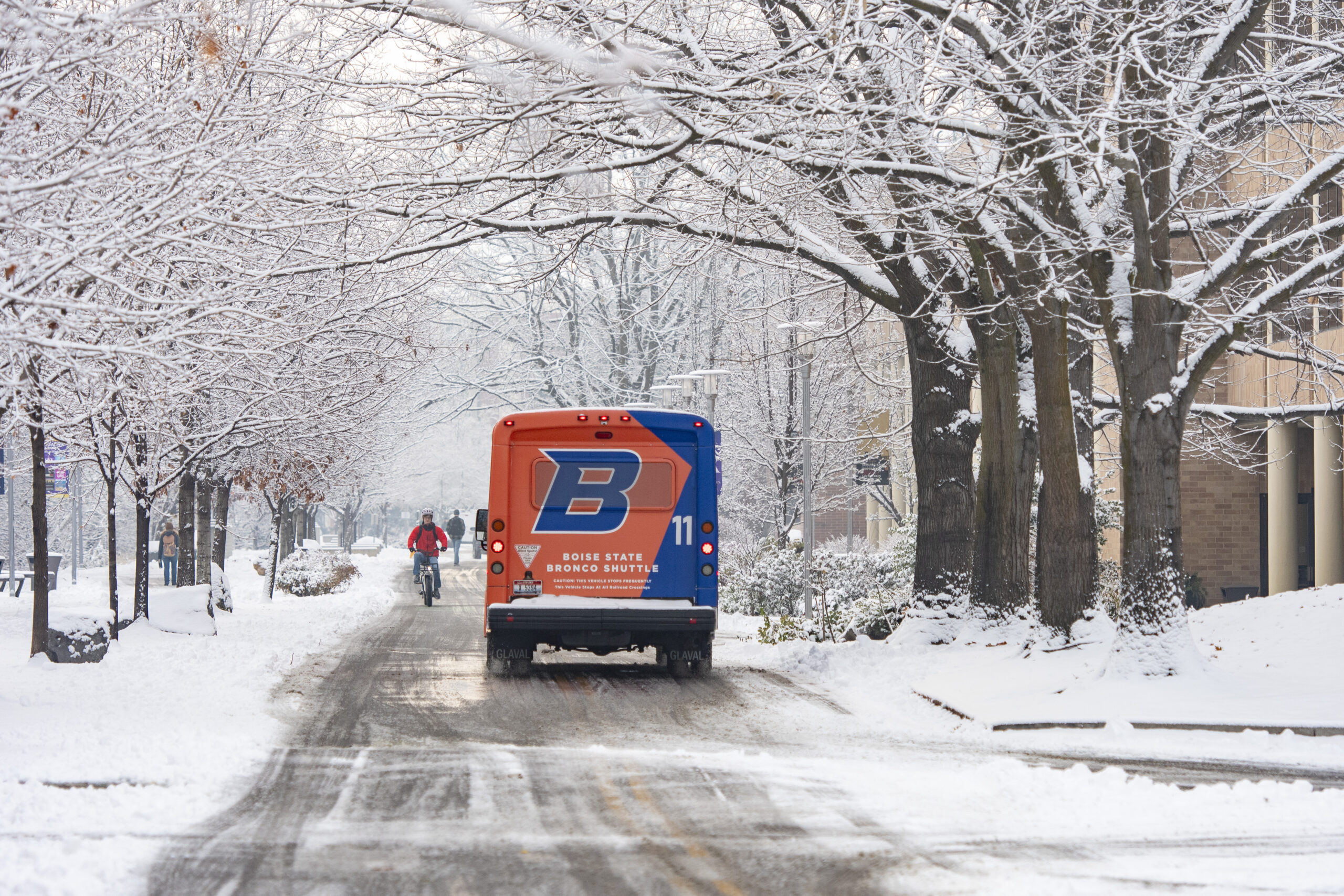 Boise State shuttle driving on campus during winter 2023