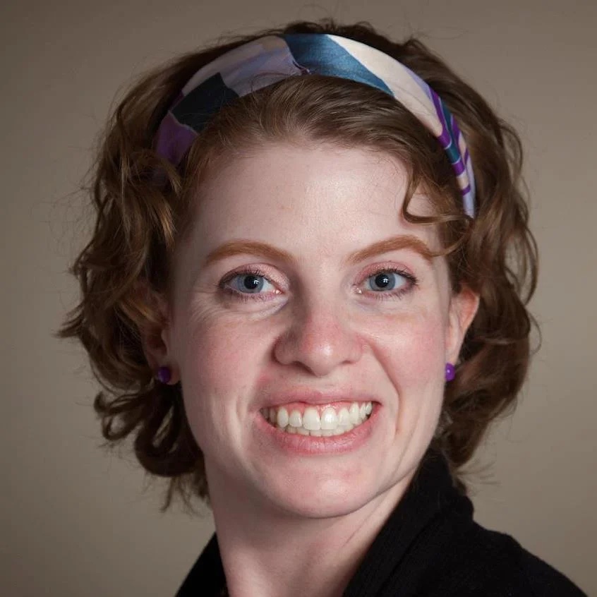 Headshot of Christine Larsen smiling.