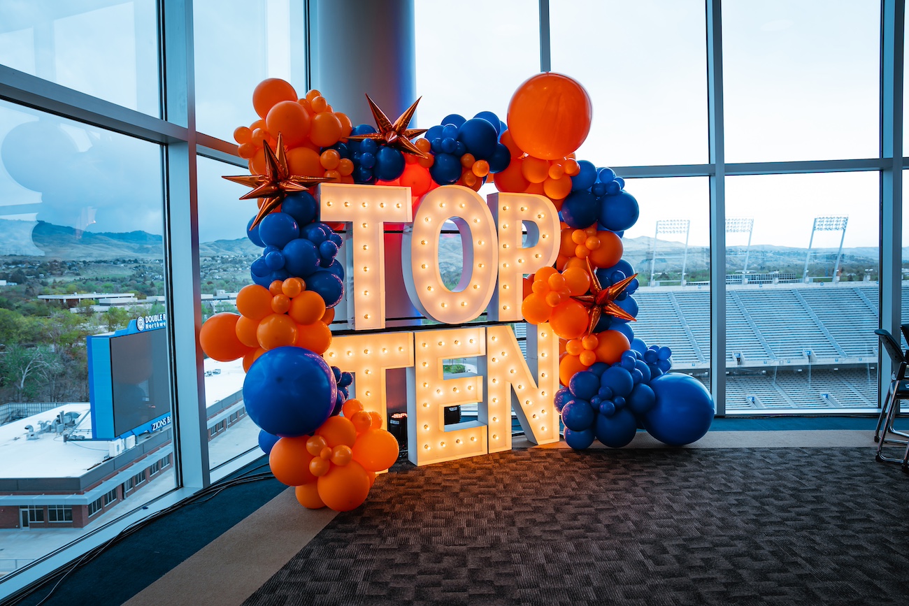 Decorations for an event in the Stuckle Sky Center: Balloons and a lighted sign that reads top ten