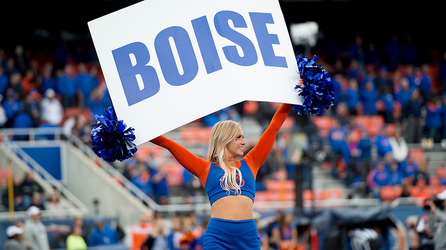 Boise State Cheerleader holds sign that says Boise