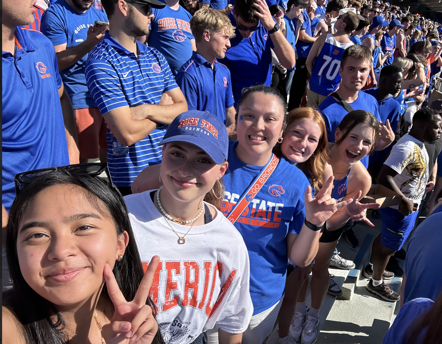 Chloe with friends at a Broncos football game