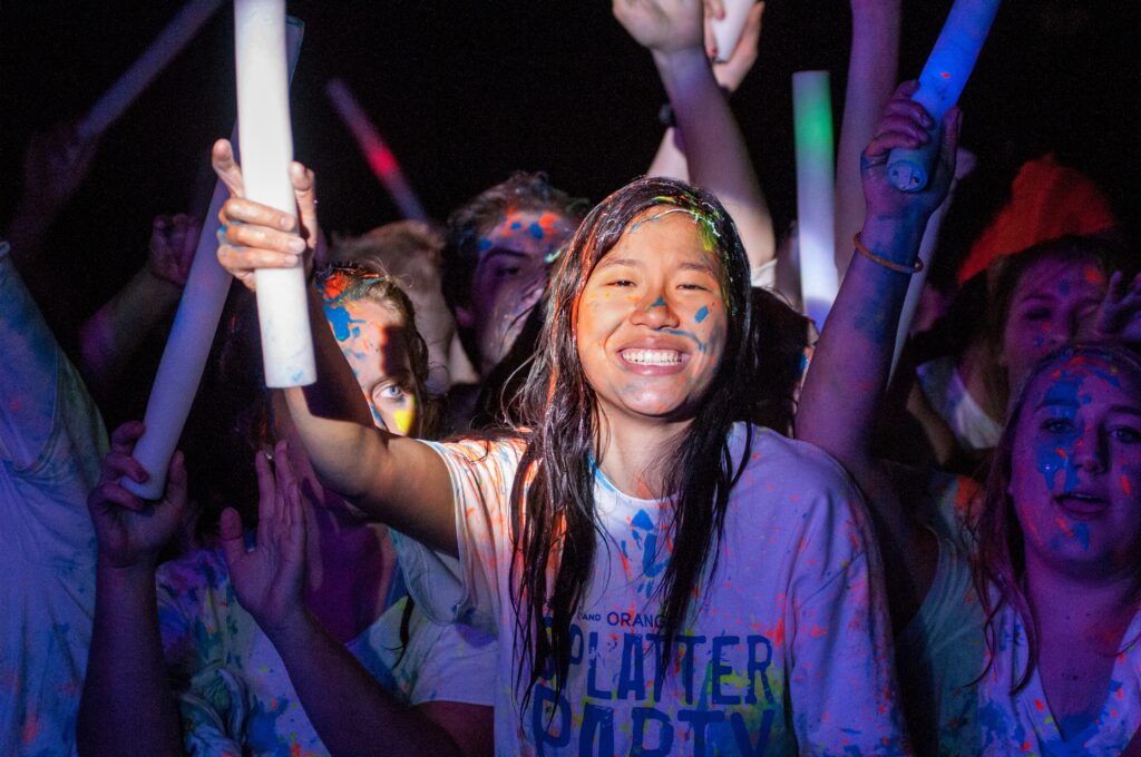 Student smiling at the annual Splatter Party.