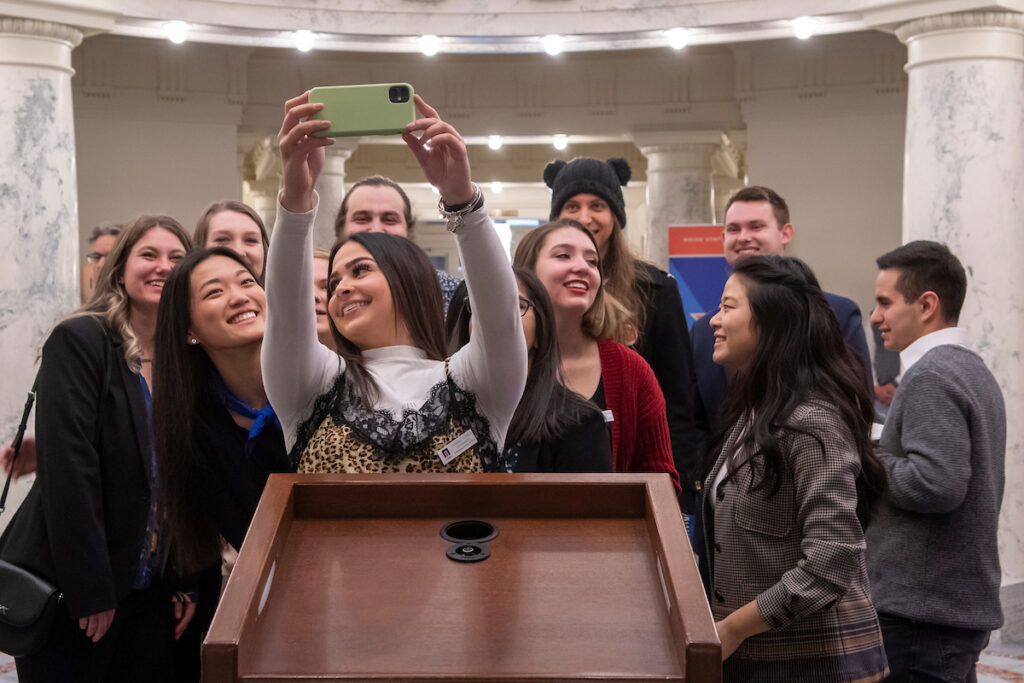 Students taking a photo at the Boise State Day at the Capitol event