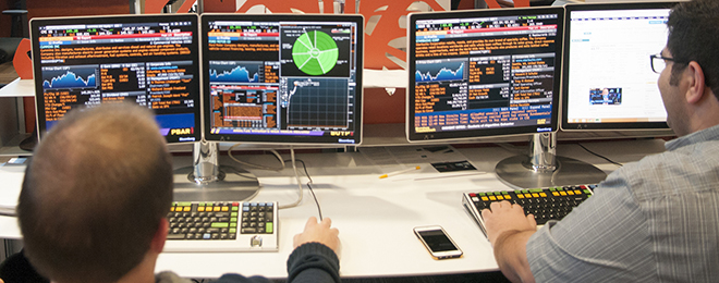 student in MBEB Dykman Trading Room