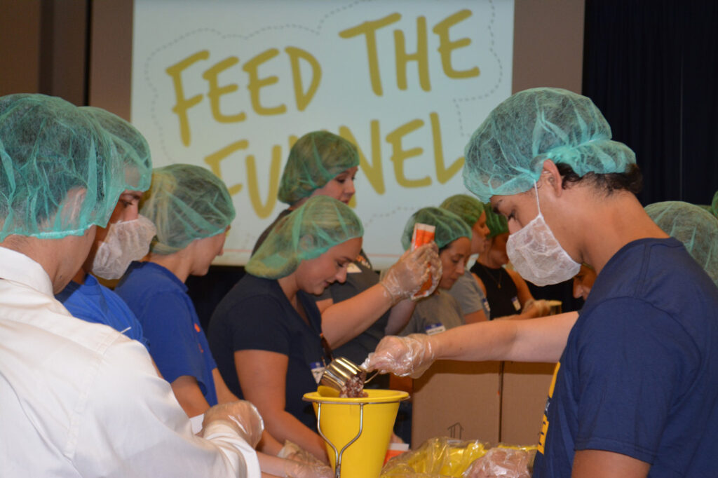 Feed the Funnel - group of students on an assembly line