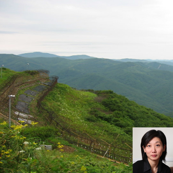 A military checkpoint in the Korean DMZ with a photo of Eleana J. Kim, professor of Anthropology at the University of California-Irvine