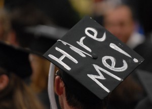 Graduation cap with "hire me" written on top