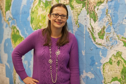 Amber Hoye with world map background