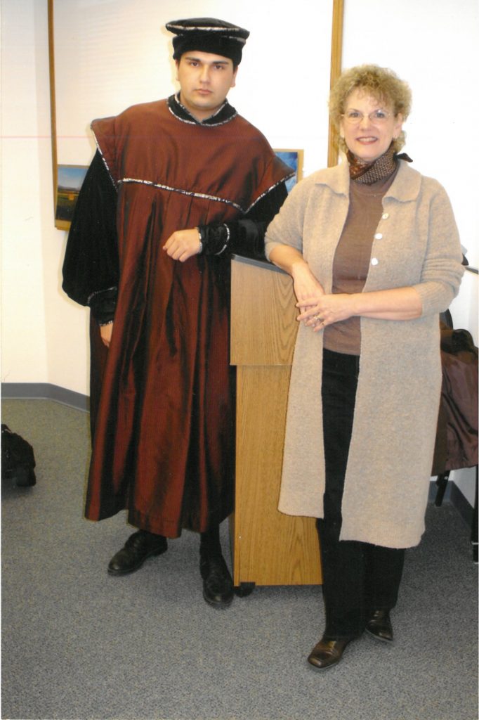 Kate Baxter with student in graduation regalia