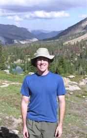 Kevin Feris outdoors with mountains